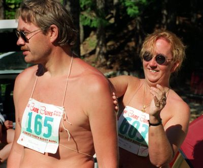 Before the start of the Bare Buns Fun Run at the Kaniksu Ranch Nudist Park, Beverly Seale, right, rubs sunscreen on her boyfriend, Stephen Peachey. More than 700 runners finished the 5K clothing-optional fun run in 1995. Kaniksu Ranch is just one of a handful of Washington state sites that welcome nudists.  (Colin Mulvany/The Spokesman-Review)