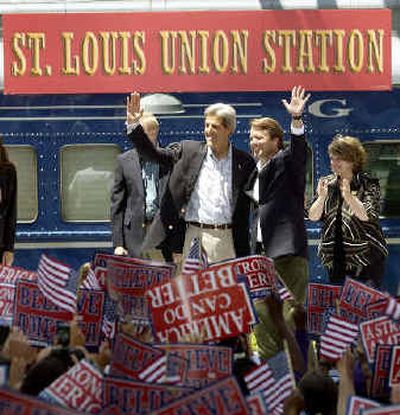 
Democratic presidential and vice presidential nominees John Kerry, left, and John Edwards wave to the crowd gathered Thursday at the historic Union Station in St. Louis.
 (Associated Press / The Spokesman-Review)