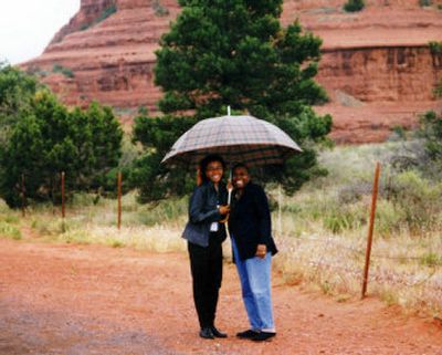 
Associated Press reporter Tania Fuentez, left, and her mother, Kay S. Queally, share an umbrella during a rainy Mother's Day visit to Sedona, Ariz., in May 1999. 
 (Associated Press / The Spokesman-Review)
