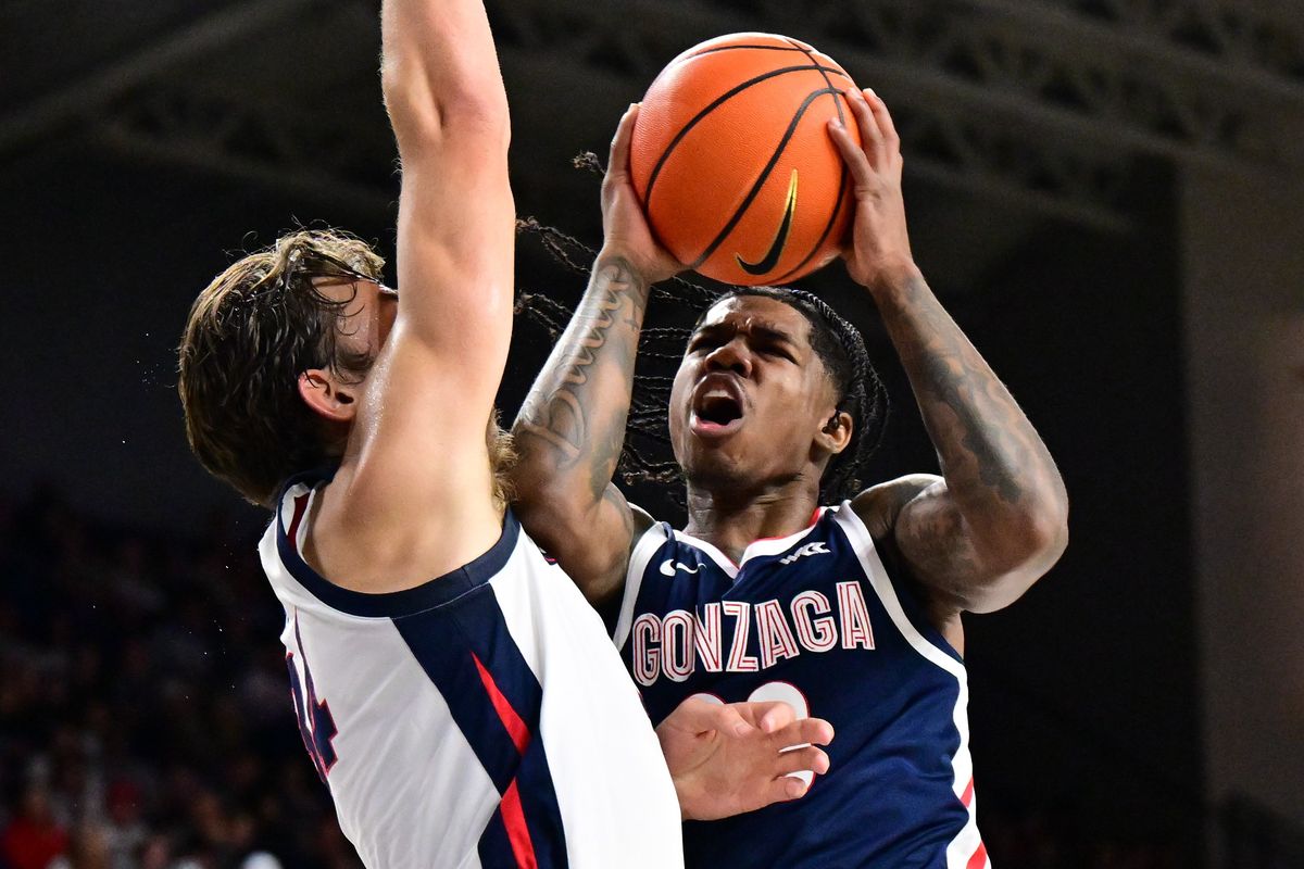 Gonzaga guard Khalif Battle heads to the rim against forward Braden Huff during Kraziness in the Kennel in early October.  (Colin Mulvany/The Spokesman-Review)