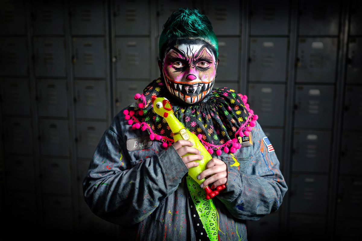 Madison Farrow, 17, poses for a photo after Scarywood makeup artists transformed her into a 3-D zombie clown that glows under black lights.  (COLIN MULVANY/THE SPOKESMAN-REVI)