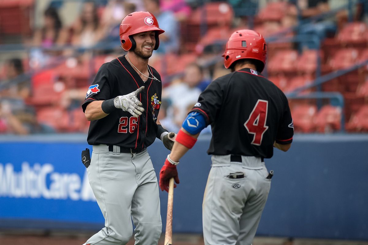 Vancouver Canadians Zac Cook (26) is congratulated by Rafael Lantingua after Cook scored a homer during the final game in a six game series against the Spokane Indians on Sunday, Aug. 1, 2021 at Avista Stadium in Spokane Valley, Wash. The Indians fell 3-6 to the Canadians but won four out of six games of this series.  (Libby Kamrowski/ THE SPOKESMAN-REVIEW)