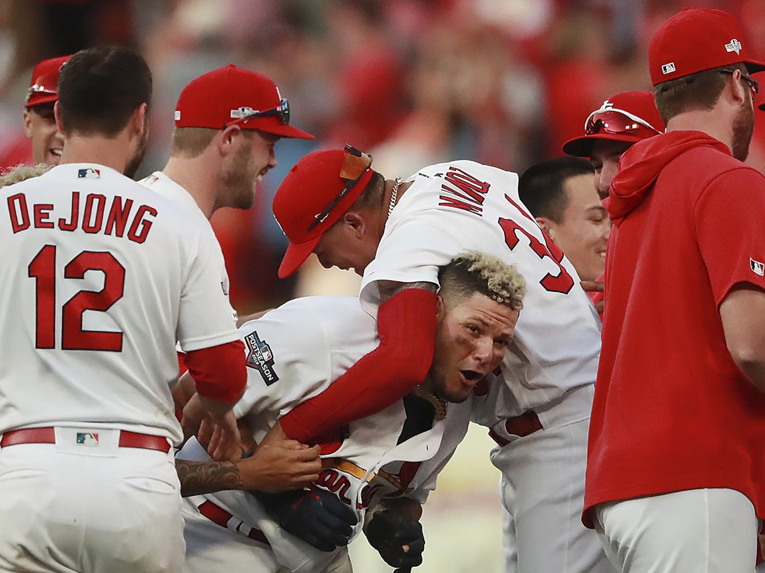 Download St. Louis Cardinals Yadier Molina celebrates a successful