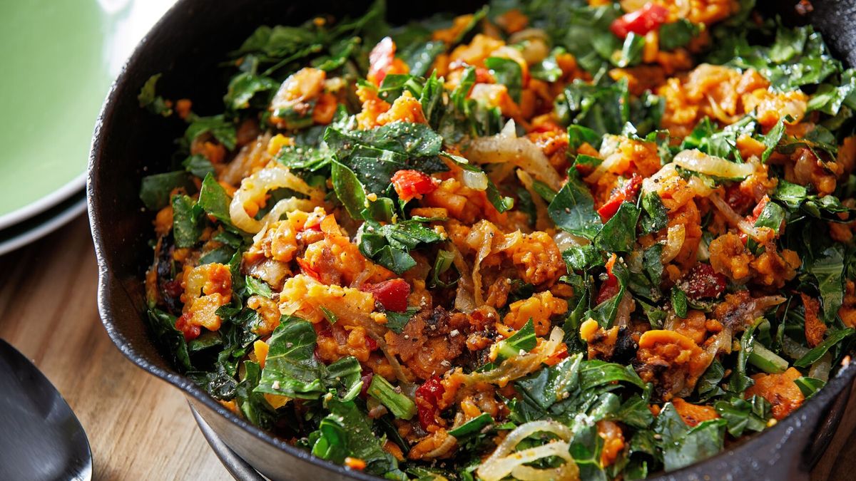 This simple dish combines sliced sweet potatoes and collard greens into something nourishing.  (Tom McCorkle/For the Washington Post)