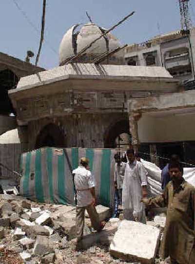
People visit the destroyed Shiite Muslim mosque Wednesday after a blast that killed 21 people last Monday in Karachi, Pakistan. People visit the destroyed Shiite Muslim mosque Wednesday after a blast that killed 21 people last Monday in Karachi, Pakistan. 
 (Associated PressAssociated Press / The Spokesman-Review)