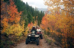 
Connie Bauer, in front, Mike Dean, center, and Roy Yablonka, participate in the Buena Vista, Colo., ATV Historical Color Tour while riding through an Aspen canopy in the old mining district of Twin Lakes. This year's rally and festival starts Wednesday.
 (Associated Press / The Spokesman-Review)