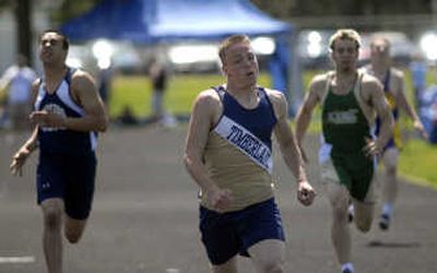 
Timberlake's Nick Puckett, center, outpaces Javier Sale of Bonners Ferry, left, and Ian Boyle of St. Maries, right, to win the 200m event  in May 2007 at the 3A district track meet held at Timberlake High in Spirit Lake. 
 (File / The Spokesman-Review)