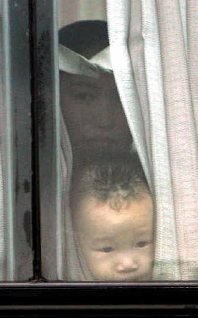 
A young North Korean looks through a bus window Tuesday while traveling on a road in Seoul.A young North Korean looks through a bus window Tuesday while traveling on a road in Seoul.
 (Associated PressAssociated Press / The Spokesman-Review)