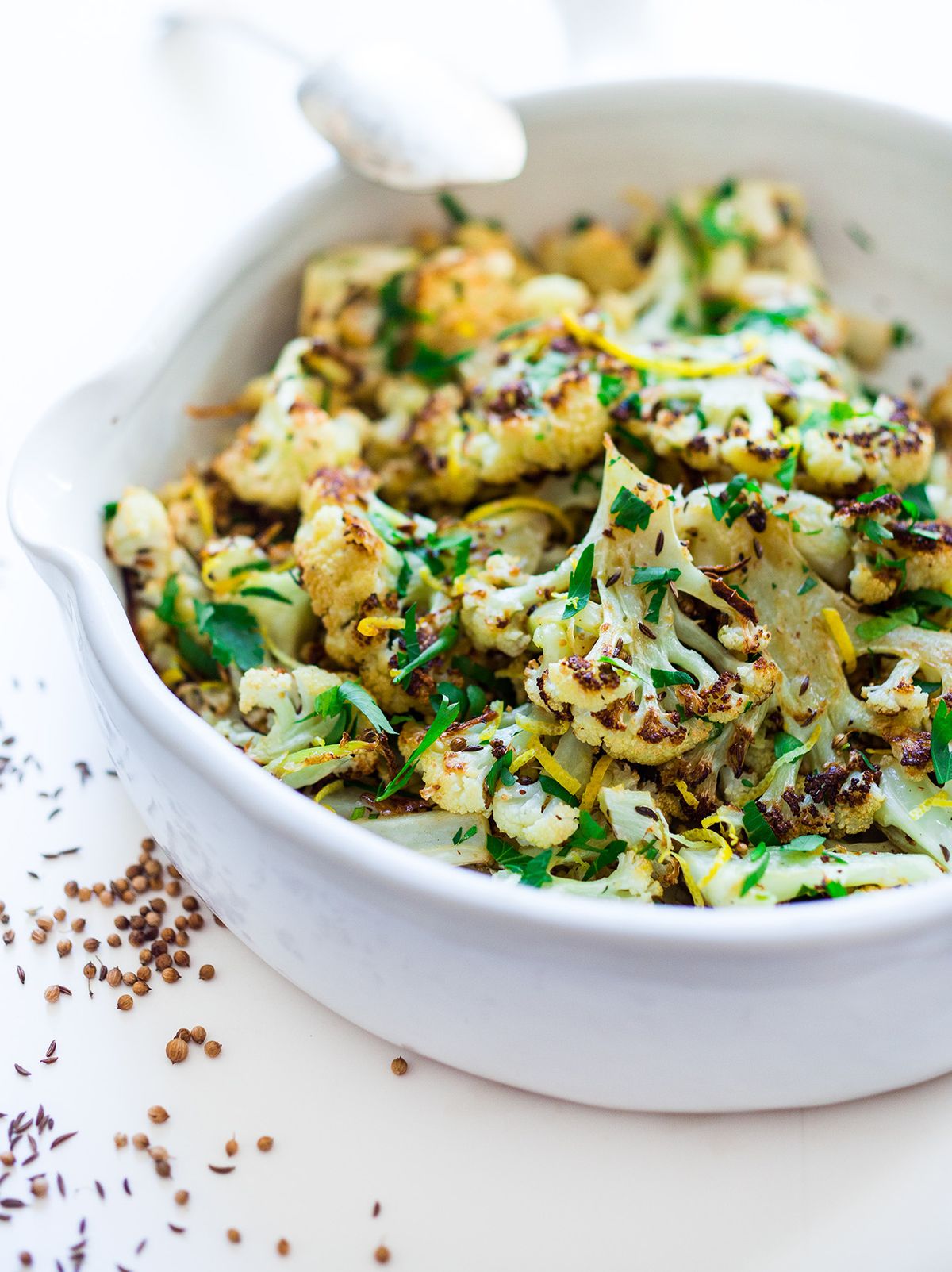 Roasted Cauliflower with Caraway and Coriander is topped with chopped Italian parsley and lemon zest. (SYLVIA FOUNTAINE)