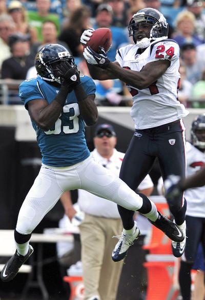 Cornerback Johnathan Joseph, right, helped the Houston Texans go from the NFL’s worst pass defense last season to the third stingiest this year. (Associated Press)
