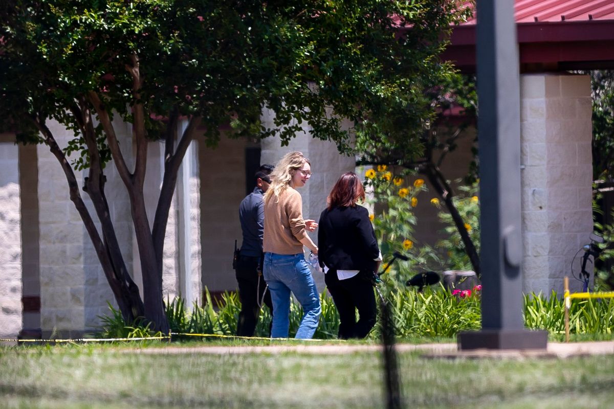 Elizabeth Holmes, the disgraced founder of the blood testing start-up Theranos, turns herself in to custody at the Federal Prison Camp in Bryan, Texas, May 30. Holmes reported to the federal minimum-security prison in Texas to begin her 11-year, three month sentence.    (Annie Mulligan/The New York Times)