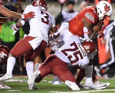 Washington State Cougars safety Skyler Thomas (25) wraps up Utah Utes running back Devin Brumfield (6) during the second half of a college football game on Saturday, September 28, 2019, at Rice-Eccles Stadium in Salt Lake City, Utah. Utah won the game 38-13. (Tyler Tjomsland / The Spokesman-Review)