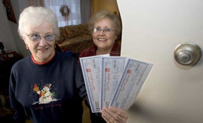 
Phyllis Perry shows off energy gift certificates she received from her daughter, Sandy Turk, at her home in Prairie du Sac, Wis. 
 (Associated Press / The Spokesman-Review)