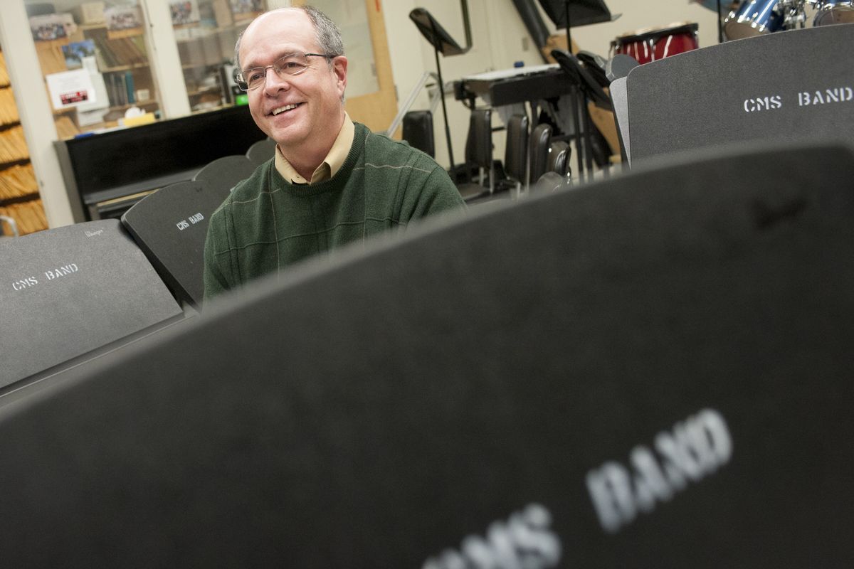 Kyle Bosch, a Centennial Middle School music teacher, smiles while reflecting on former pupil Christian Pepin on Wednesday at the school. Pepin recently won a Grammy with the band Pacific Mambo Orchestra. He called Bosch to thank him. (Tyler Tjomsland)