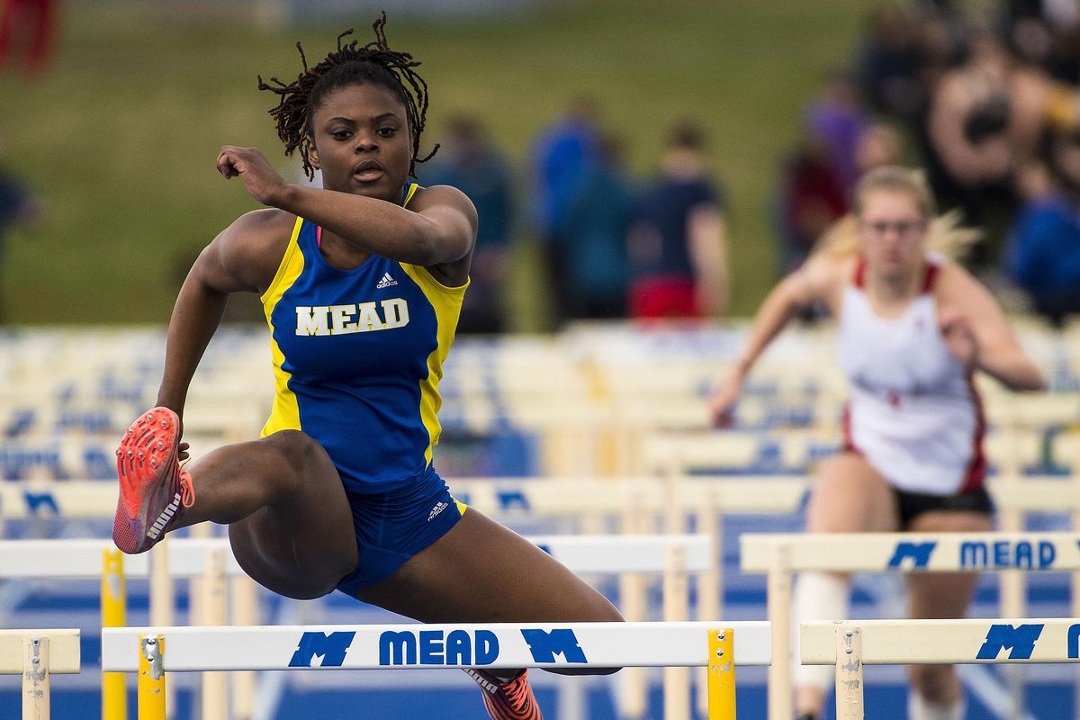 Zella Conley of Mead wins the girls 100 meter hurdles at a GSL track meet held Thurs., April 13, 2017, at Mead high School. (Colin Mulvany / The Spokesman-Review)
