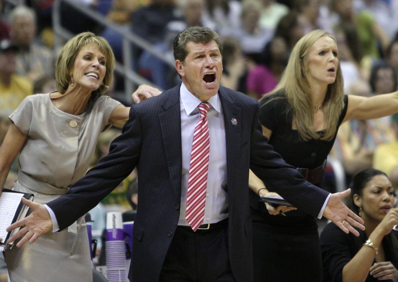 UConn coach Geno Auriemma, center, and assistants Chris Dailey, left, and Shea Ralph express themselves during the first half of the Huskies’ win over Baylor. (Associated Press)