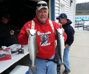 An angler weighs his kokanee catch in a Two Rivers Resort fishing derby. (courtesy)