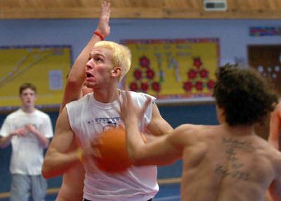 
 John Hutchins moves through the defense to the basket during practice. Hutchins, at 6-foot-5, has added some size to the Eagles.
 (Jesse Tinsley / The Spokesman-Review)