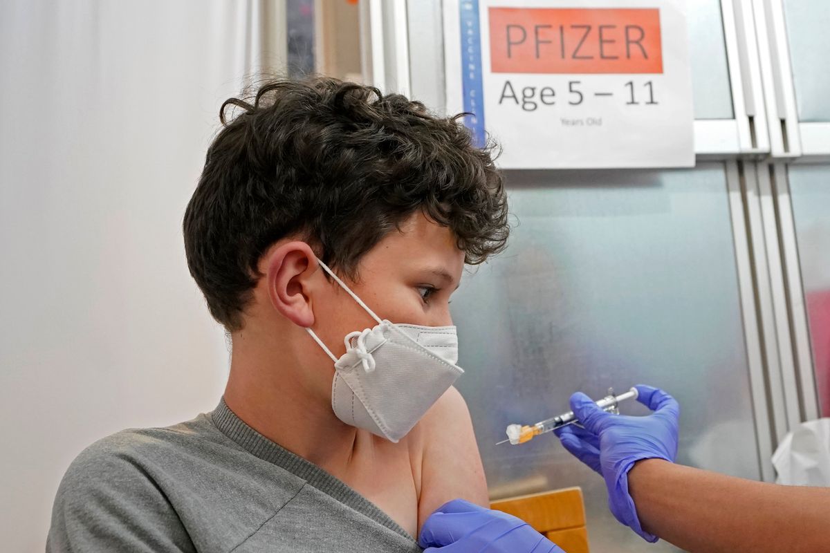 Leo Hahn, 11, gets the first shot of the Pfizer COVID-19 vaccine, Tuesday, Nov. 9, 2021, at the University of Washington Medical Center in Seattle. Last week, U.S. health officials gave the final signoff to Pfizer