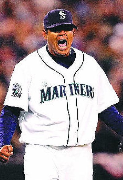 Felix Hernandez punched out 12 Oakland A's in Mariners' 4-0 season-opening victory Monday.
(Associated Press / The Spokesman-Review)