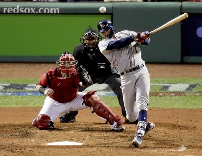 In this Oct. 13, 2018, file photo, Houston Astros’ Carlos Correa, right, watches his RBI-single against the Boston Red Sox during the sixth inning in Game 1 of a baseball American League Championship Series in Boston. Houston shortstop Correa and Washington Nationals outfielder Michael A. Taylor became the first players of the year to go to salary arbitration hearings. (Elise Amendola / Associated Press)