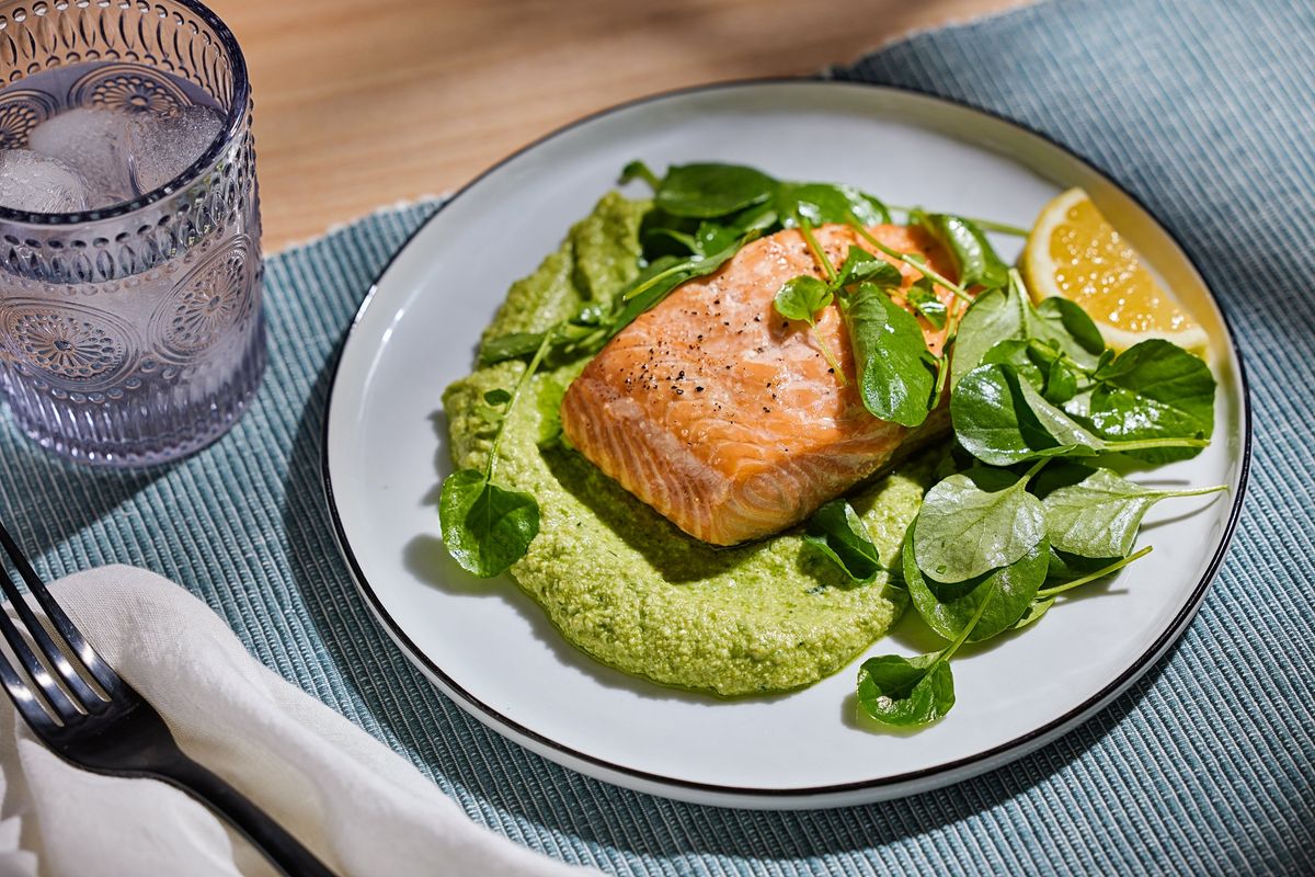 Roasted salmon is planted on a creamy, verdant spread of feta and peas. (Tom McCorkle for The Washington Post/Food styling by Gina Nistico for The Washington Post)
