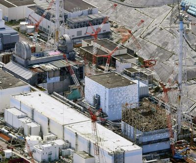 An aerial photo Sept. 4, 2017, shows Fukushima Dai-ichi nuclear power plant’s reactors, from bottom at right, Unit 1, Unit 2 and Unit 3, in Okuma, Fukushima prefecture, northeastern Japan.  (Daisuke Suzuki)