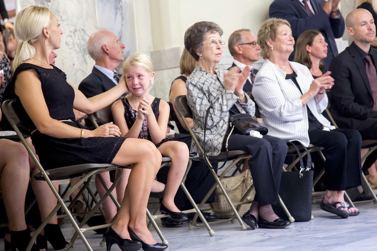 Carol May Andrus, middle, wife of former  Gov. Cecil Andrus, claps after Mayor David Beiter’s announcement that Capitol Park would be renamed after her husband during a ceremony Wednesday  to honor Andrus at the Idaho State Capitol in Boise.  Andrus will lie in state at the Idaho State Capitol until noon  Thursday. (Kyle Green / Kyle Green/Idaho Statesman)