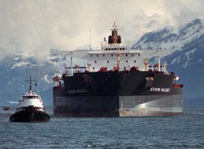 
Tugboats pull the crippled tanker Exxon Valdez toward Naked Island in Prince William Sound, Alaska, on April 5, 1989. Associated Press
 (File Associated Press / The Spokesman-Review)