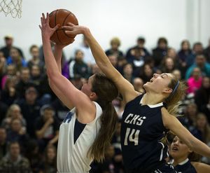 Chiawana's Braydey Hodgins (14) tries to block a shot by Gonzaga Prep's Oona Harrington during the first half of a girl's basketball game, Friday, Feb. 21, 2014, at Gonzaga Preparatory School. (Colin Mulvany / The Spokesman-Review)