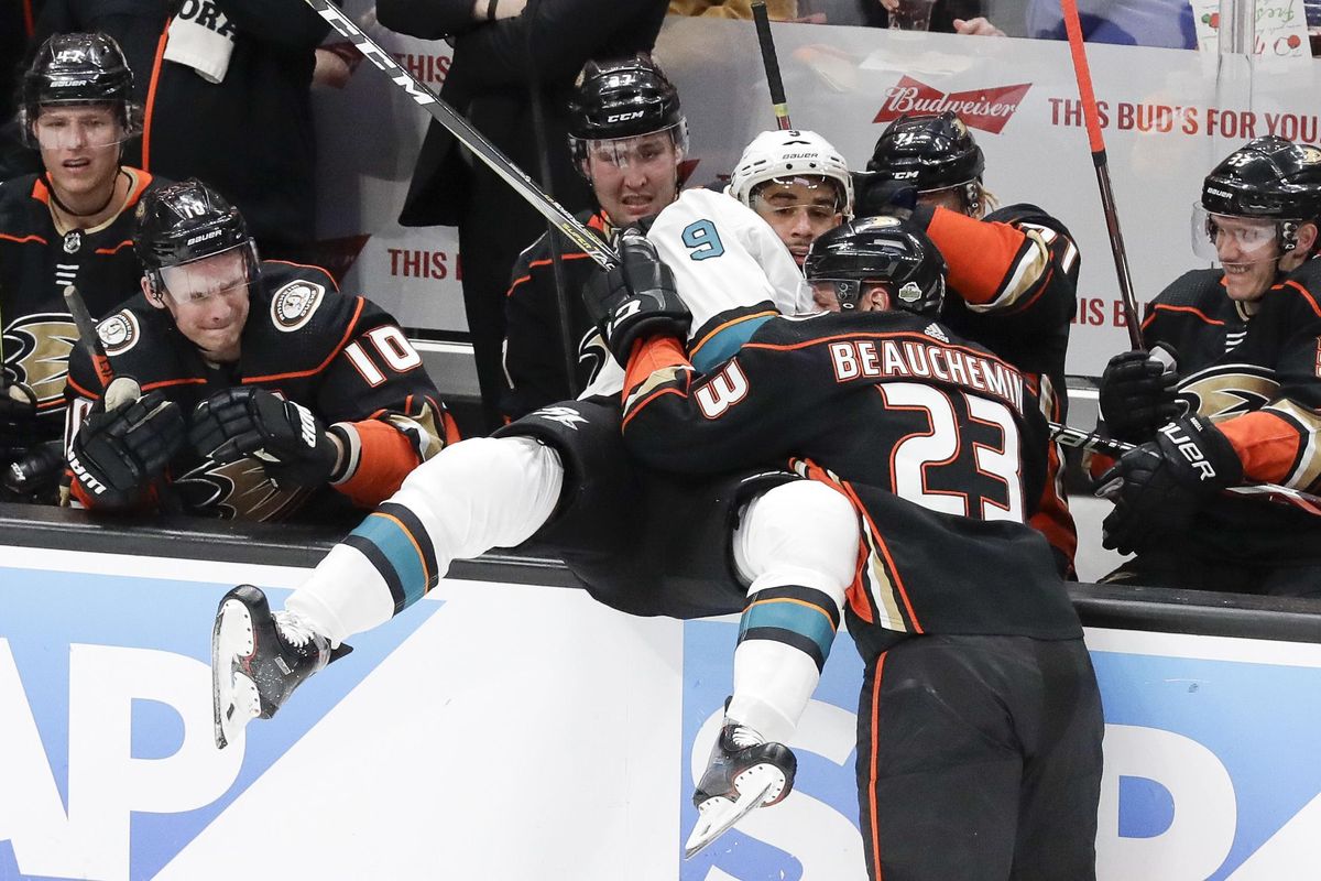 Anaheim Ducks defenseman Francois Beauchemin, right, checks San Jose Sharks left wing Evander Kane into the bench during the first period of Game 2 of an NHL hockey first-round playoff series in Anaheim, Calif., Saturday, April 14, 2018. (Chris Carlson / Associated Press)