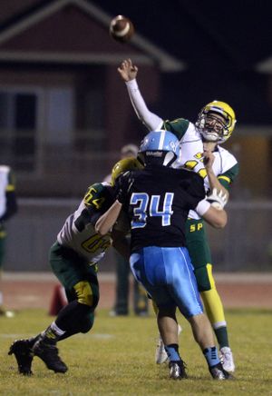 Shadle Park quarterback Brett Rypien lets fly with a long pass over Central Valley's defense in the first half of the battle of the GSL powerhouses Friday, Oct. 25, 2013 at CVHS. (Jesse Tinsley / The Spokesman-Review)