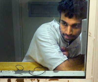 
Lance Karunaratne sits in a jail interview room talking about his experience with police Nov. 9, 2005. 
 (File / The Spokesman-Review)