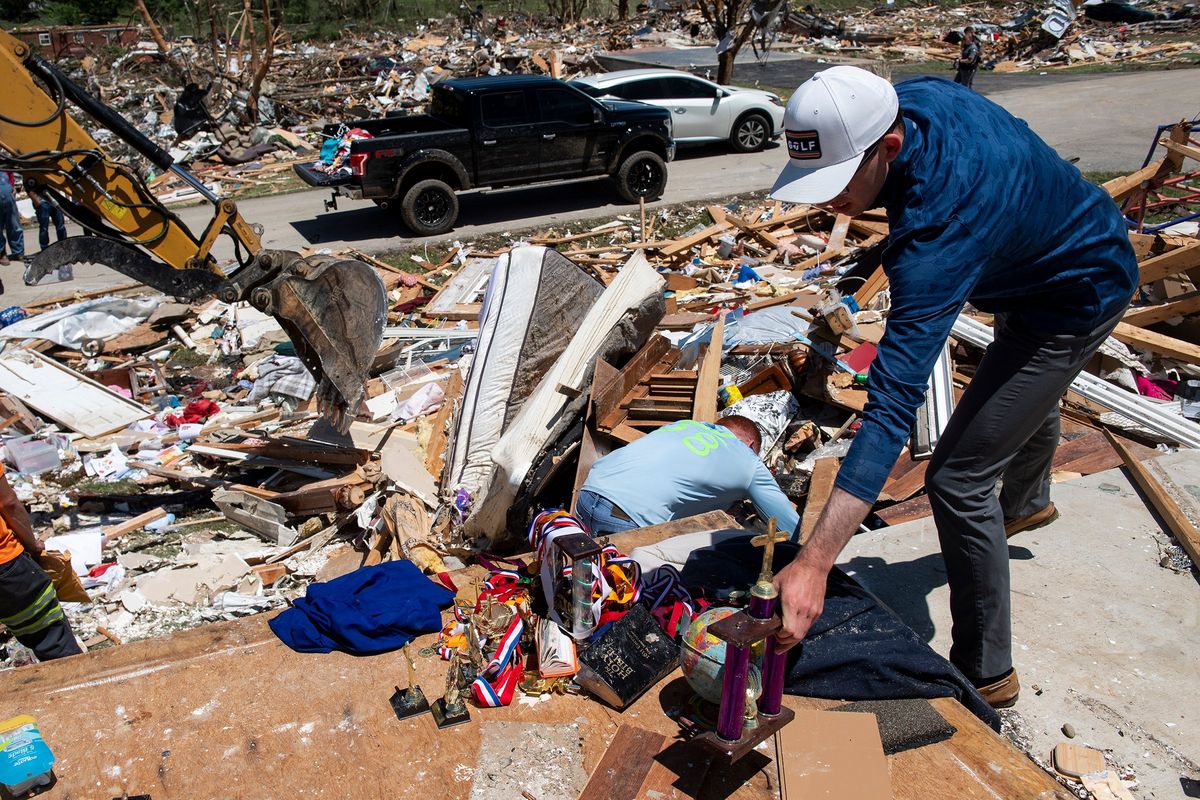Community members and crews clean up debris in the neighborhood of Sunshine Hills on Saturday in London, Kentucky.  (Michael Swensen)