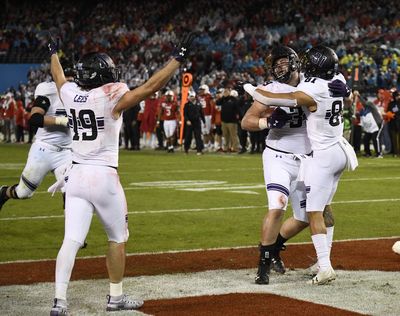 Northwestern offensive lineman Trey Klock (39), center, is congratulated by wide receiver Ramaud Chiaokhiao-Bowman (81) after scoring a touchdown during the second half of the Holiday Bowl NCAA college football game against Utah, Monday, Dec. 31, 2018, in San Diego. (Denis Poroy / AP)