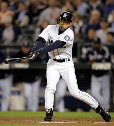 
Seattle's Ichiro Suzuki singles in the first inning on Tuesday for his 197th base hit of the season.
 (Associated Press / The Spokesman-Review)