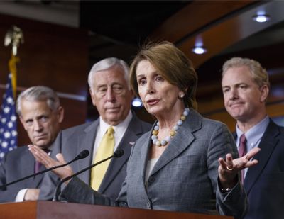 House Minority Leader Nancy Pelosi and House Democratic leaders discuss their disagreement with Speaker of the House John Boehner on Saturday. (Associated Press)