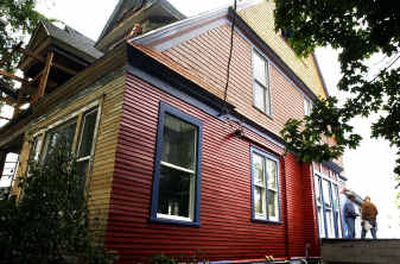 
James and Kris Yasord are restoring this 1899 Queen Anne with computer wiring, a master bedroom suite, air conditioning and a bright color scheme at a fraction of what it would cost in most larger cities. 
 (Jed Conklin / The Spokesman-Review)