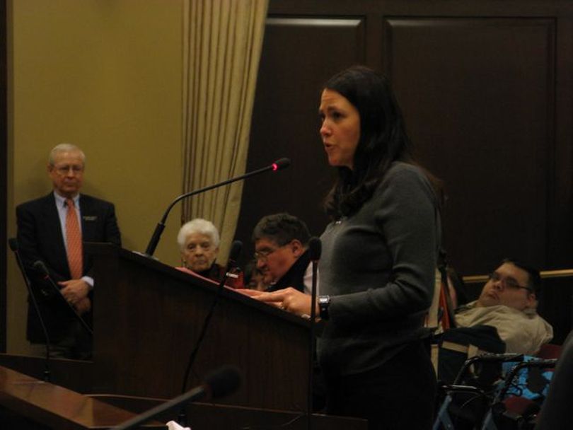 Denise Wetzel of Coeur d'Alene testifies about the value of developmental therapy services her 10-year-old son receives, and how they couldn't be provided by a volunteer. She was one of hundreds who attended a public hearing Friday on Health & Welfare funding. (Betsy Russell)