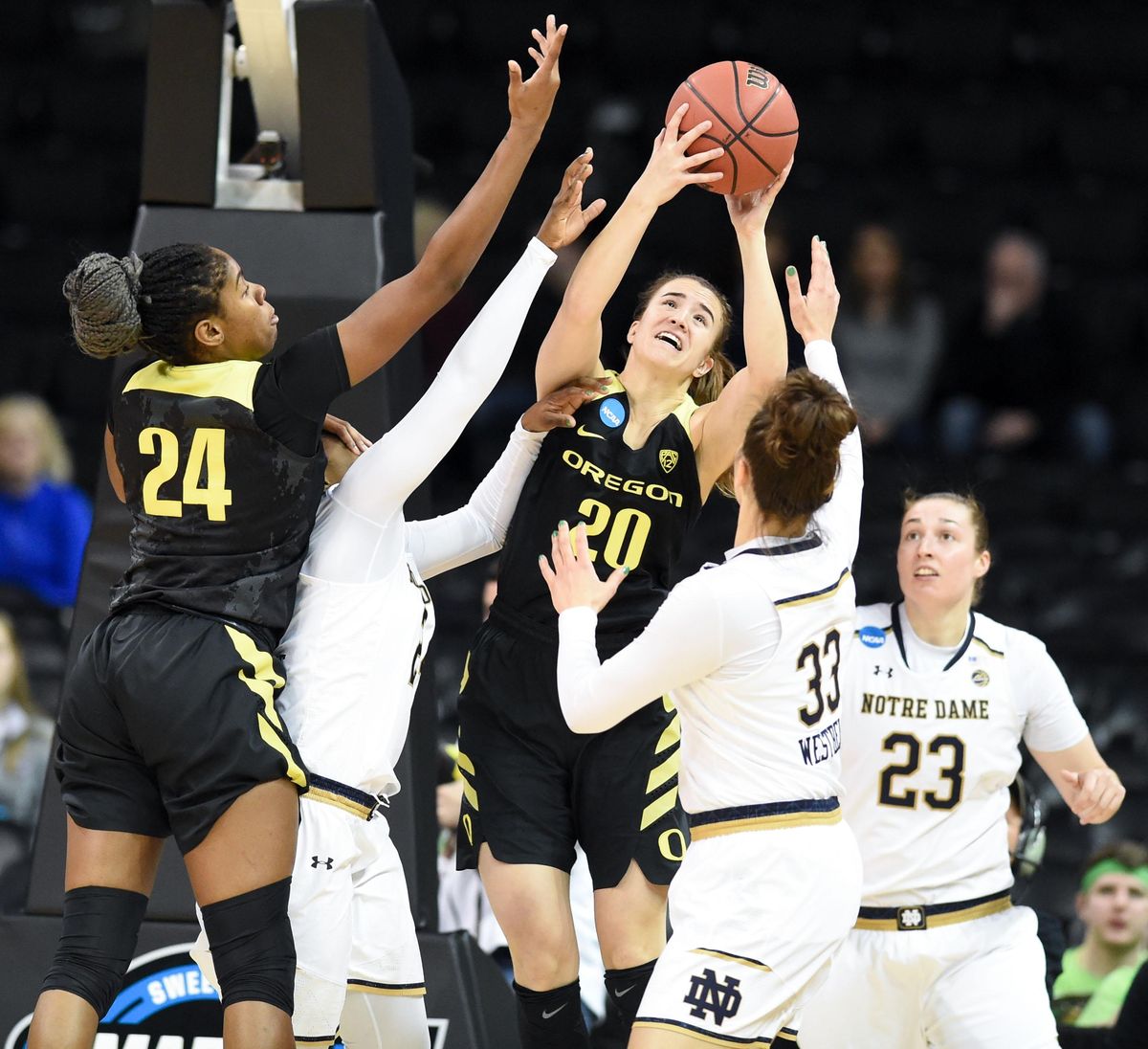 Oregon Ducks guard Sabrina Ionescu (20) rebounds the ball against the Notre Dame Fighting Irish during the first half of a 2018 NCAA Women