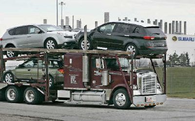 
A car carrier leaves the Subaru of Indiana Automotive Inc., plant.  
 (Associated Press / The Spokesman-Review)
