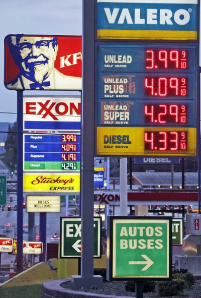 Gas prices are posted at stations in Breezewood, Pa., this week. Gas prices are high but have started to level off. (Associated Press)