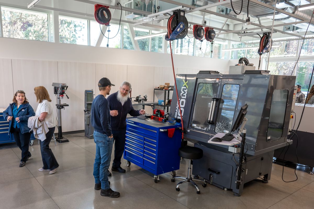 Visitors to Whitworth University’s new PACCAR Engineering Building check out a CNC milling machine used to create prototype metal parts. The building, dedicated on Thursday, is named after the Washington-based company that’s one of the largest truck manufactures in the world. The $20 million facility will hold six teaching labs, two fabrication and prototyping shops and numerous research labs. (Colin Mulvany/The Spokeman-Review)