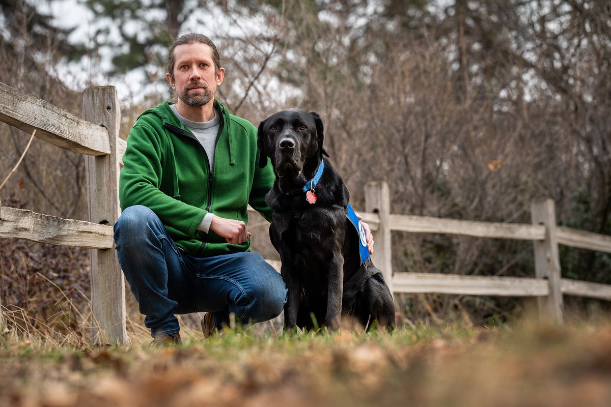 Mark Kloehn, a victim advocate with Lutheran Community Services, will be one of several advocates partnering with police as they process new DNA test results in cold cases, some of which result in new leads. Mark is often accompanied by their certified therapy dog, Walker.  (Colin Mulvany/THE SPOKESMAN-REVIEW)