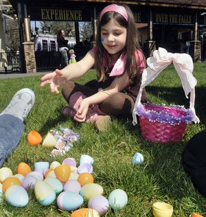 Looking for prizes, Lissette Palavicini, 6, cracks open the Easter eggs she gathered Saturday. (Dan Pelle)