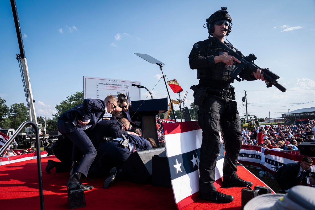 U.S. Secret Service agents and counterassault team react moments after shots were fired toward Republican presidential candidate and former president Donald Trump during a rally in Butler, Pa., on Saturday. MUST CREDIT: Jabin Botsford/The Washington Post (Jabin Botsford/The Washington Post)